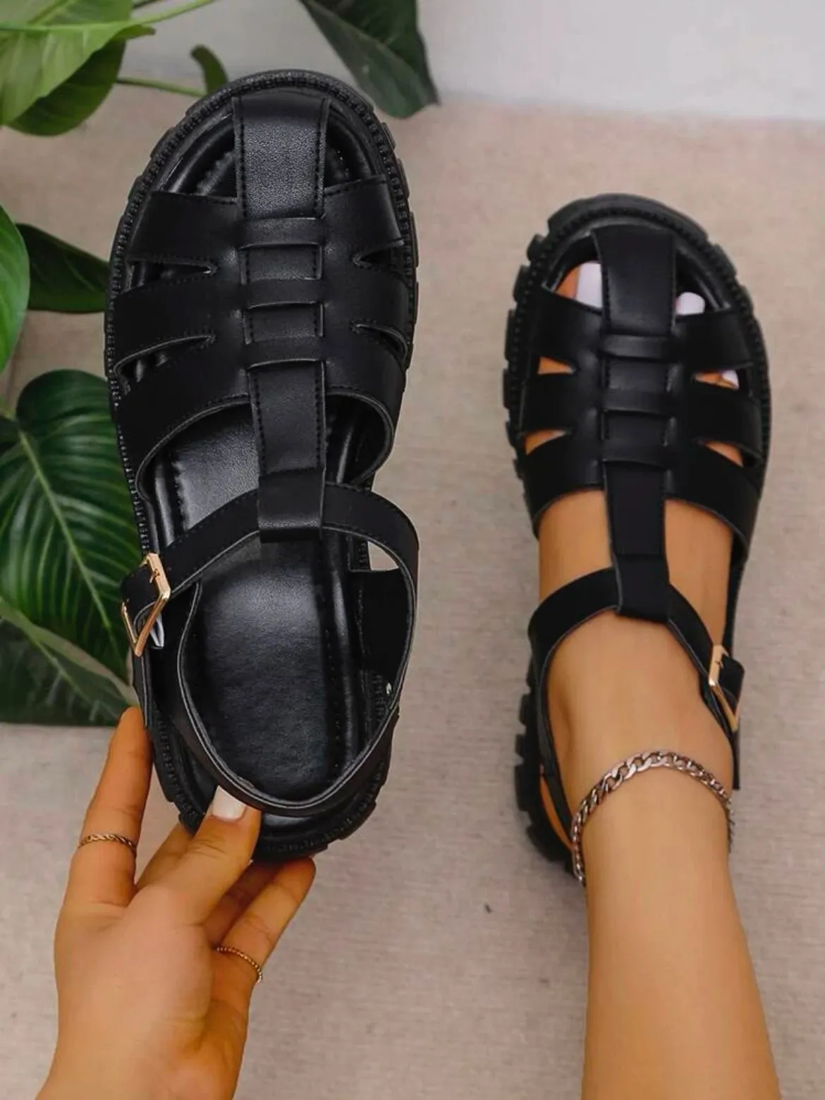 Black plastic sandals