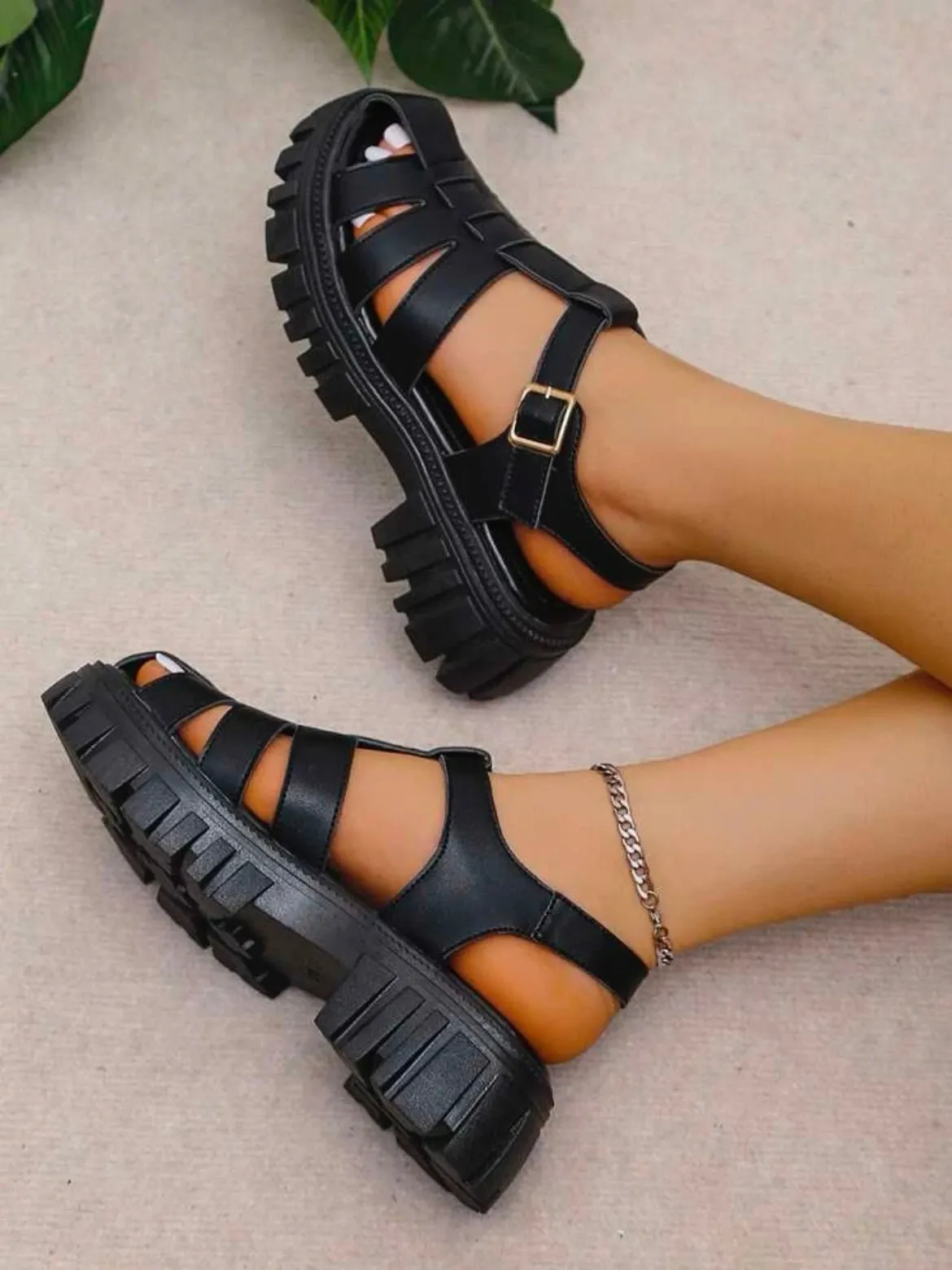 Black plastic sandals